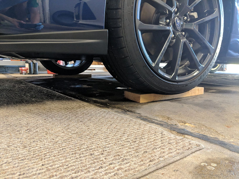 Jacking up the front of the WRX - ramps come in handy for clearance