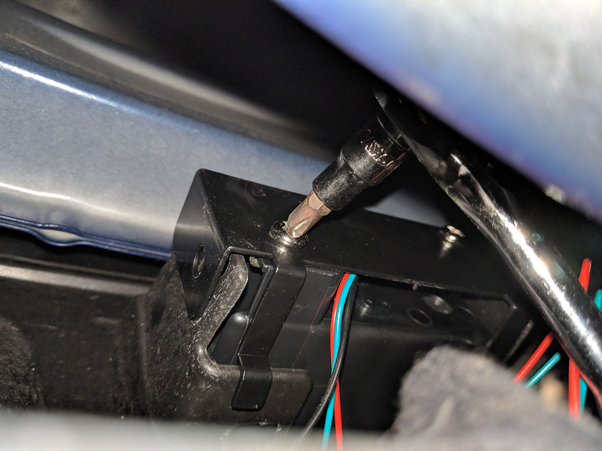 Makeshift stubby screwdriver in use