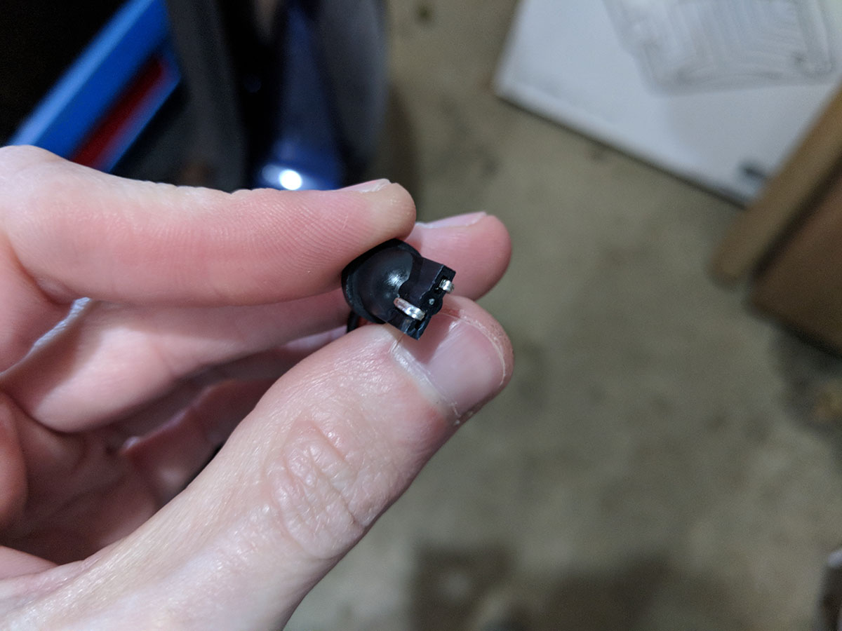 LED license plate plug pins